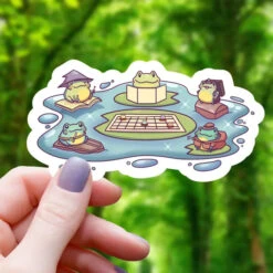 FROGS PLAYING RPG IN POND STICKER